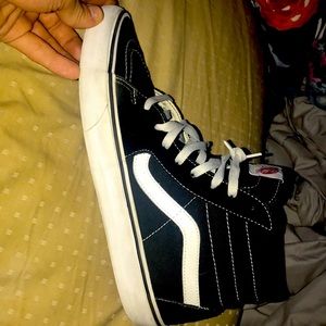Black and white high top Vans